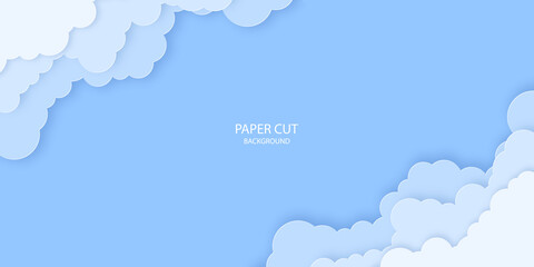 Fluffy paper cut out clouds on blue sky background.