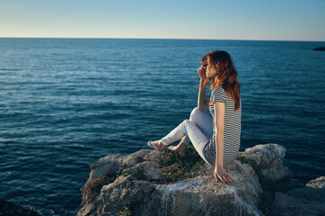 traveler on the beach in the mountains blue sea and clouds top view