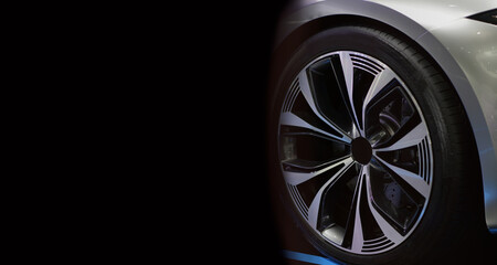 Detail of the Sport car wheel modern car on black background,copy space.