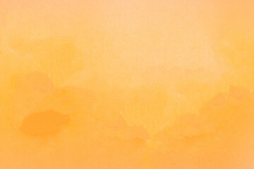 Natural background of yellow orange textured paper.