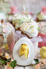 Easter composition with orthodox sweet breads or kulich decorated with white sugar icing and mastic flowers. Traditional Orthodox cake. Holiday concept.