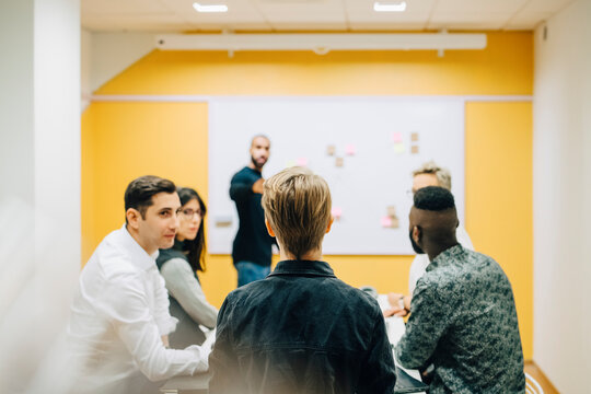 Business people brainstorming during meeting in board room at office
