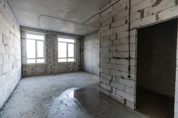 The Interior of the new room without finishing in the newly built high-rise building