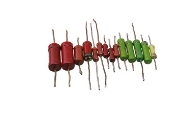 row of color-coded vintage metal-film resistors with leads for through-hole mounting. isolated on...