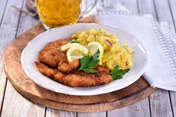 Traditional fried chicken schnitzel in yoghurt marinade