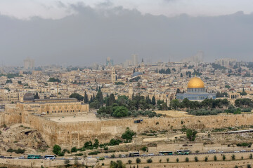 Fototapeta premium Most important world holy places. Panorama of the old city Jerusalem, the Dome of the Rock, monumental defensive walls