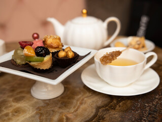 selective focus. Tea time with cake and cookies and cane sugar . Breakfast time. 