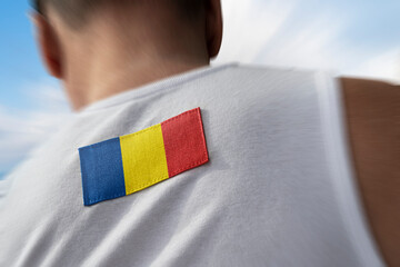 The national flag of Romania on the athlete's back