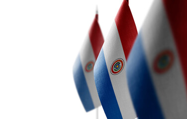 Small national flags of the Paraguay on a white background