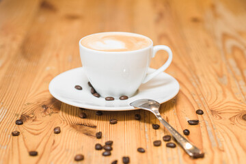 Delicious and aromatic cappuccino coffee on the table in a coffee shop