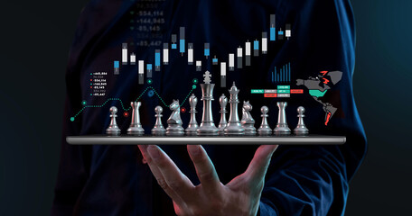 Businessman hold chess on tablet, investment strategy stock market concept.
