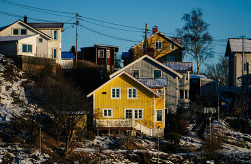 Fototapeta na wymiar colorful houses in the winter yellow house
