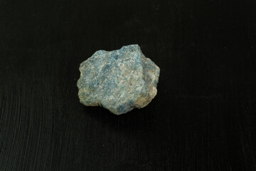 Apatite from Madagascar. Natural mineral stone on black background. Mineralogy, geology, magic of stones, semi-precious stones and samples of minerals. Close-up macro photo.