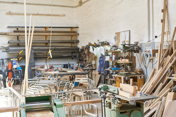 Cabinet maker workshop with lots of chairs