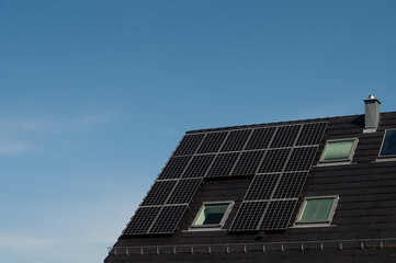 Fototapeta premium solar panels on the roof of a house