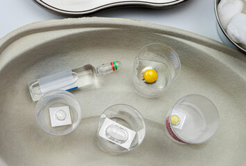 Fototapeta na wymiar Diverse medication in glasses monodose in hospital, conceptual image