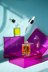 Yellow Oil with levitating dropper on Pink glass Podium with Blue Background and Sunlight