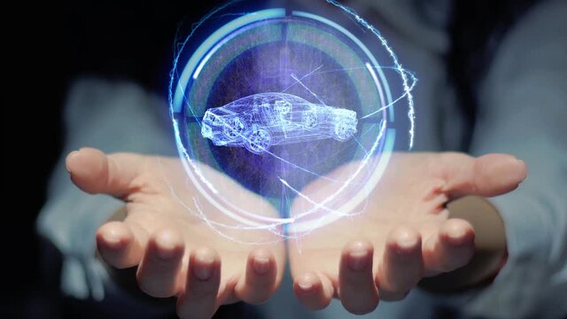 Female hands show a round conceptual hologram with wireframe sport Car racing vehicle. Unrecognizable woman in ashen white on a black background with future holographic technology