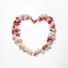 Beautiful heart shaped floral composition on light background, flat lay