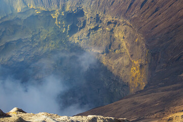 Active crater with smoke and sulfur, view from the observation deck of erupting and active Bromo volcano. Bromo Tengger Semeru National Park, East Java, Indonesia.