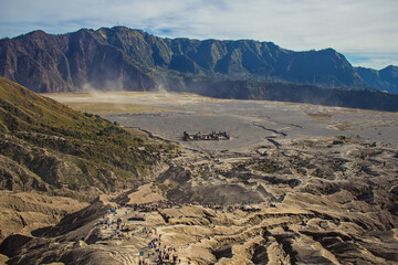 Fototapeta na wymiar View from the top of Mount Bromo on people descending from the crater of this volcano, Bromo Tengger Semeru National Park
