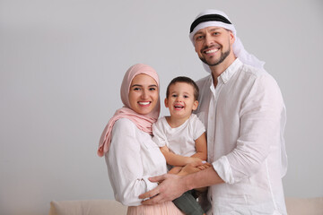 Happy Muslim family spending time together at home