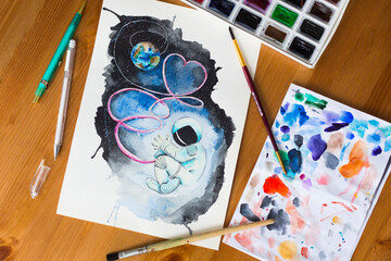 Watercolor picture of the cosmonaut, connected to the Earth by an umbilical cord, in outer space,...