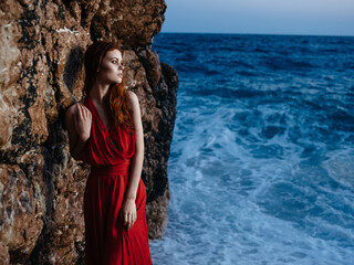 Woman in red dress nature landscape sea luxury charm