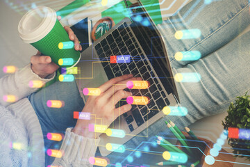 Double exposure of woman hands working on computer and data theme hologram drawing. Tech concept.