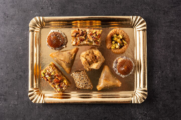 Assortment of Ramadan dessert baklava on black background