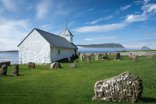 Church with tombstones, in the village of Kirkjub&oslash;ur on Streymoy, Faroe Islands.