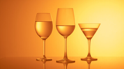Glass wine glasses on a colored background