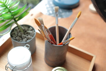 A set of paint-brush in a can