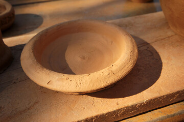 Handmade earthenware utensils. Empty clay pot background texture.