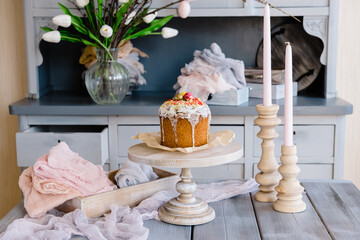 European Easter with traditional decorative eggs, tulips, pussy willow and Easter cake.