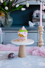 On a gray wooden table and Easter cake, Easter cake with an Easter rabbit, a sweet table for the holiday, Easter holiday.