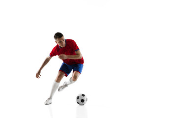 Young Caucasian soccer football player training isolated on white background.