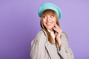 Photo of dreamy lovely girl look empty space hand cheekbone wear blue beret coat isolated violet color background