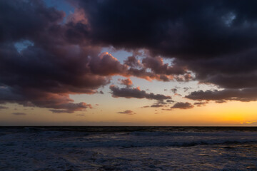 Cloudy sunset at the stormy sea.