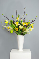 bouquet for easter. willow bouquet. Spring flowers.  easter decor. willow branches in a vase on a light background. 