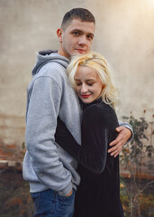 Fototapeta premium embrace. guy hugs his beloved girl. expression of feelings through hugs