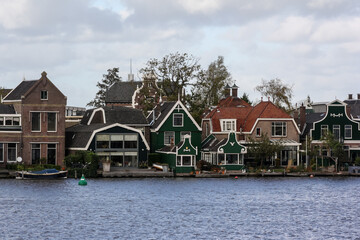 Fototapeta na wymiar View of the village of Zaanse Schans, in the Netherlands, on the bank of the river Zaan.