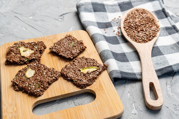 snacks made from flax seeds and dried fruits. healthy ingredients. close up