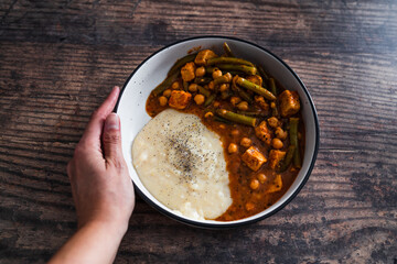 vegan chickpea green beans stew with tofu cubes and mashed potato, healthy plant-based food