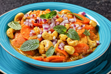 carrot curry with cashew and raisins, top view