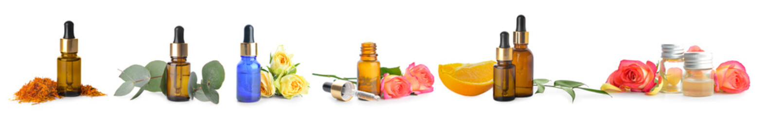 Different essential oils on white background