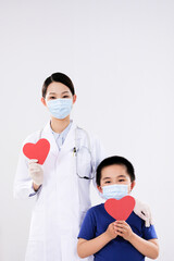 A woman doctor and a little boy each had a red heart