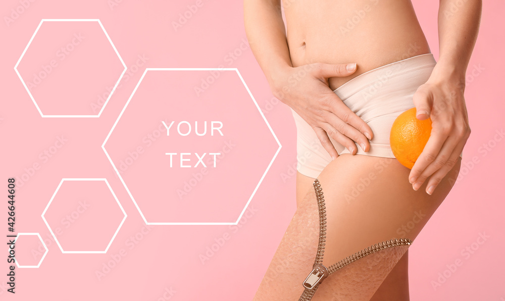 Wall mural young woman with orange fruit on color background with space for text. concept of cellulite