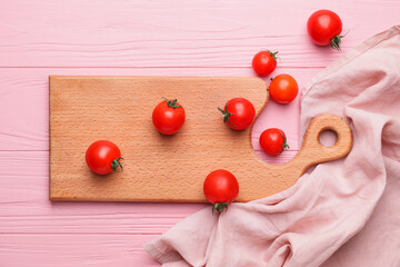 Cutting board with tomatoes on color wooden background