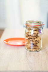 Glass jar with delicious oatmeal cookies with chocolate chips